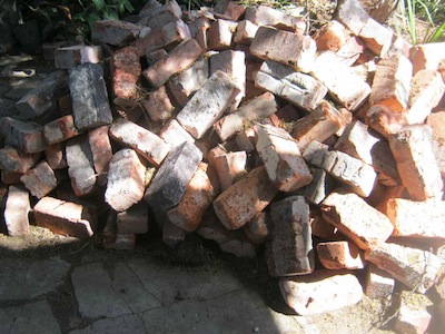 patient bricks await pond construction