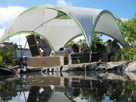 Workshop attendees and Josh from Guerilla House at the board in some temporary shade