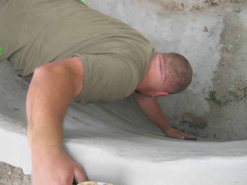 Marc smoothing the cement