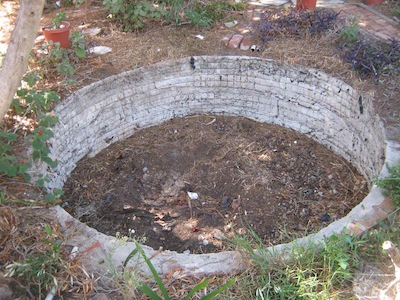 stage one of the pond building, a retaining wall in the ground