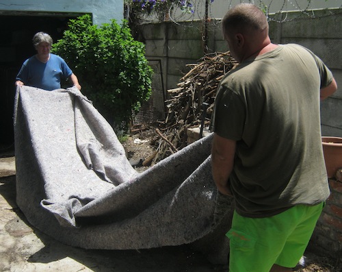 Marc and Stephan lay out underfelt to cut the base