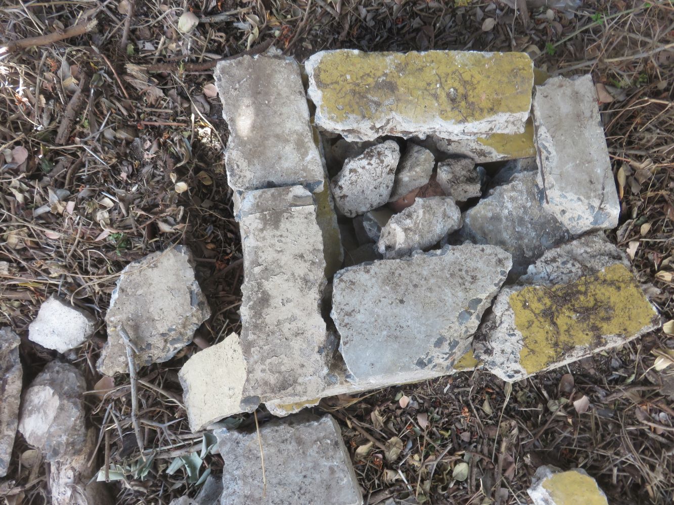 The square hotel walls are filled with loose rubble.