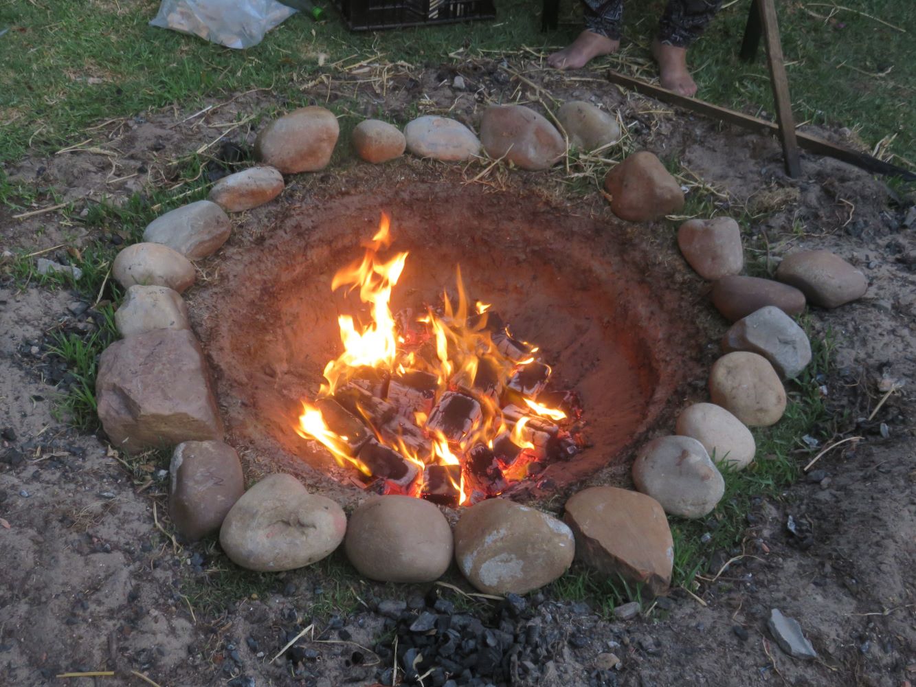 a conical fire pit in the sand