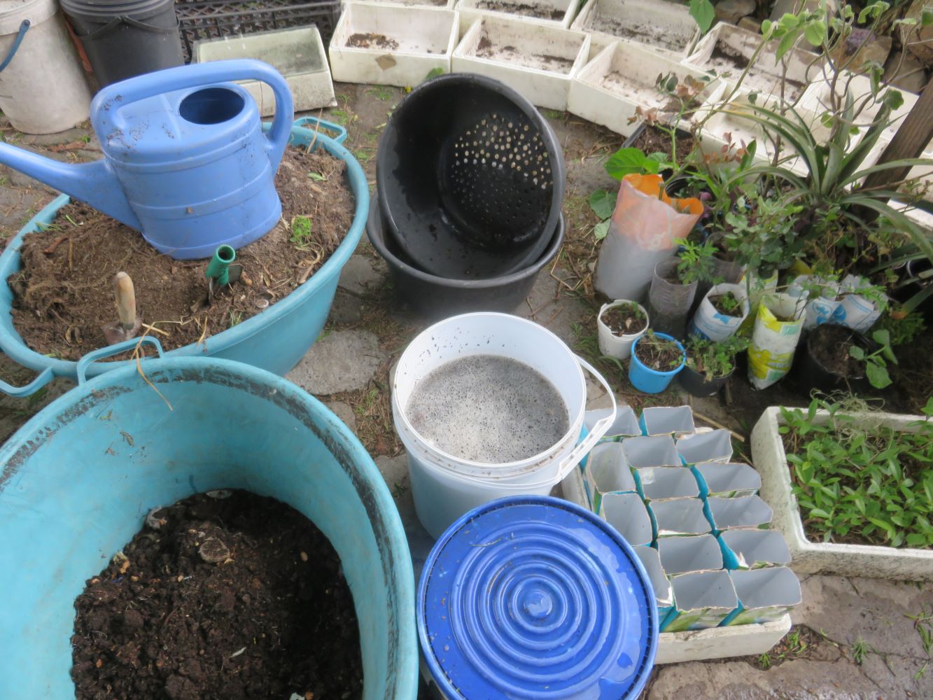 A sieve for separating the biochar from the liquid, buckets of ferments and vermicast.